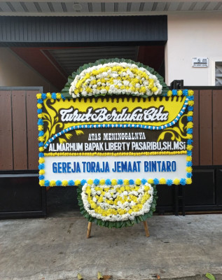 Papan Bunga Duka di Tibawa